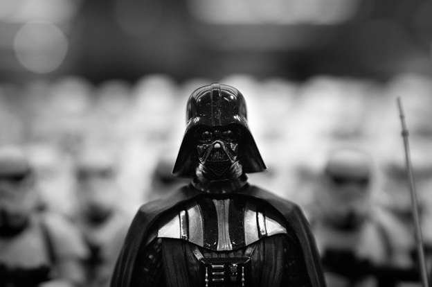 A person in a Darth Vader costume against a blurred background